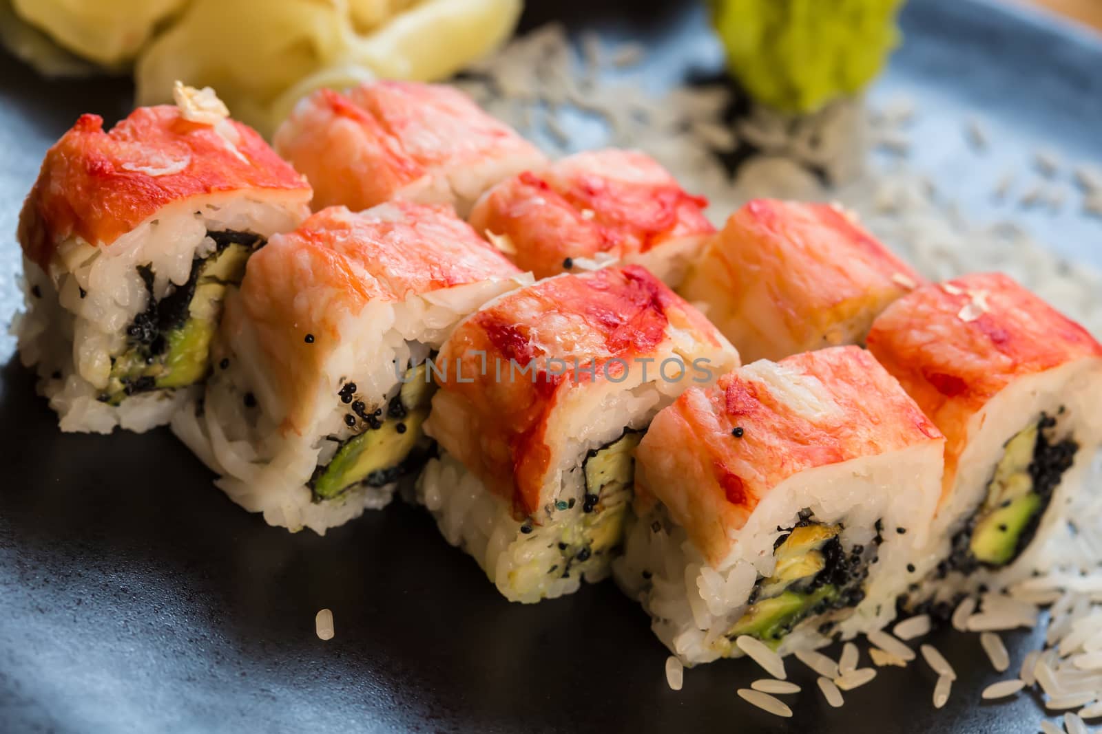 set of Japanese sushi on a black plate