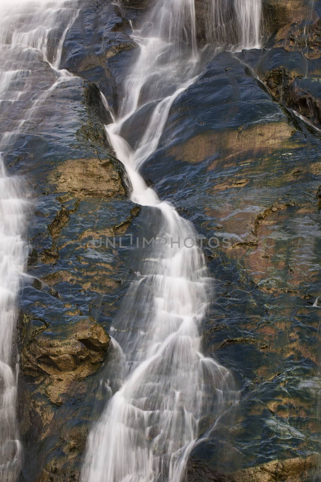 Waters of Mendenhall Glacier flow downward at Nugget Falls, Juneau, Alaska. 