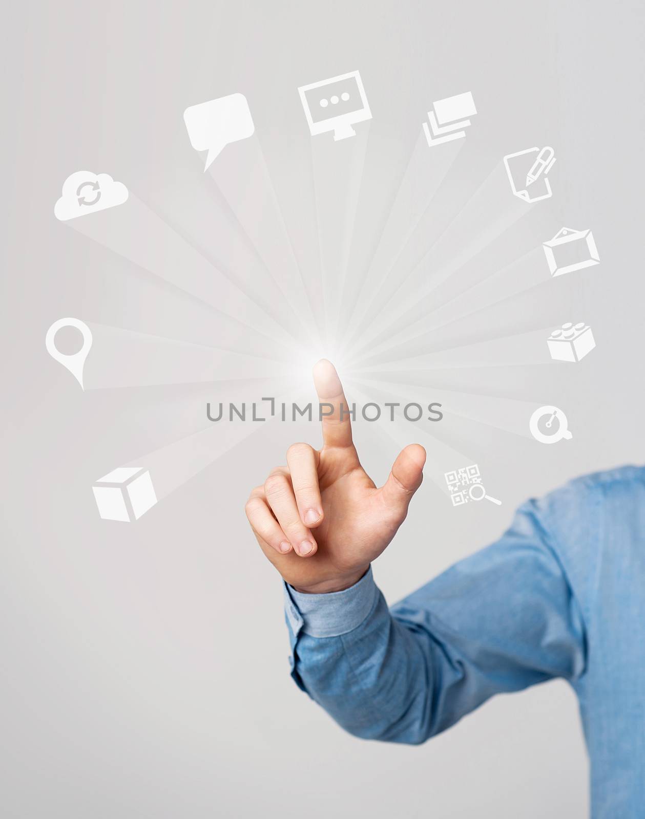 Human hand pressing modern media icons on virtual screen
