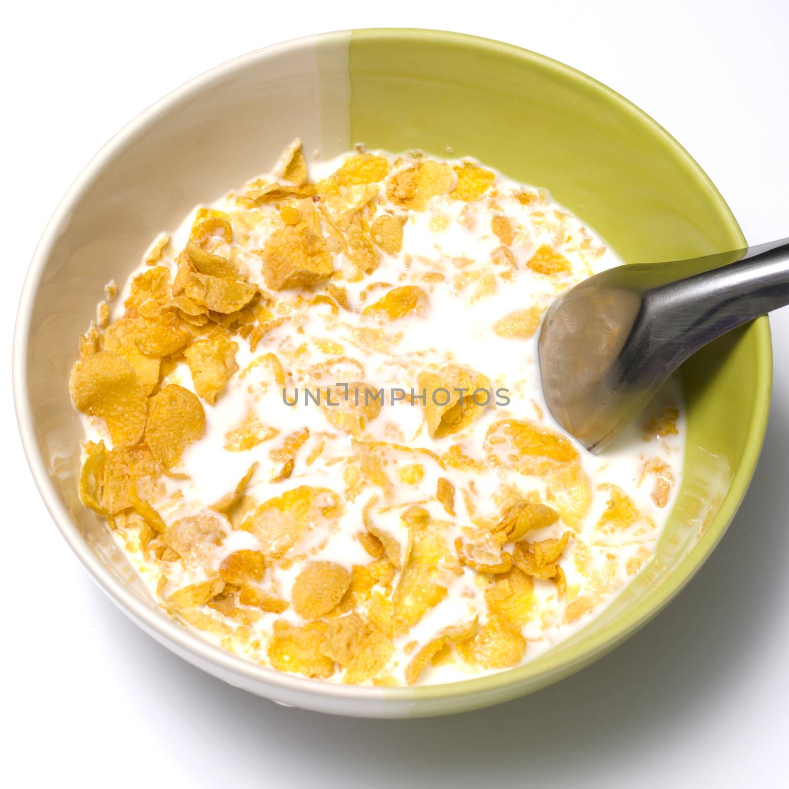 corn flakes in bowl on a white background