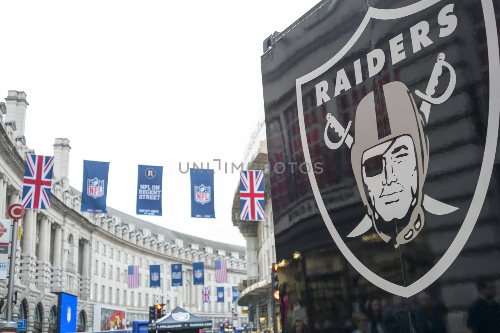 LONDON, UK - SEPTEMBER 27: Detail of Oklahoma Raiders banner and NFL flags above in Regent Street. September 27, 2014 in London. The street was closed to traffic to host NFL related games and events.