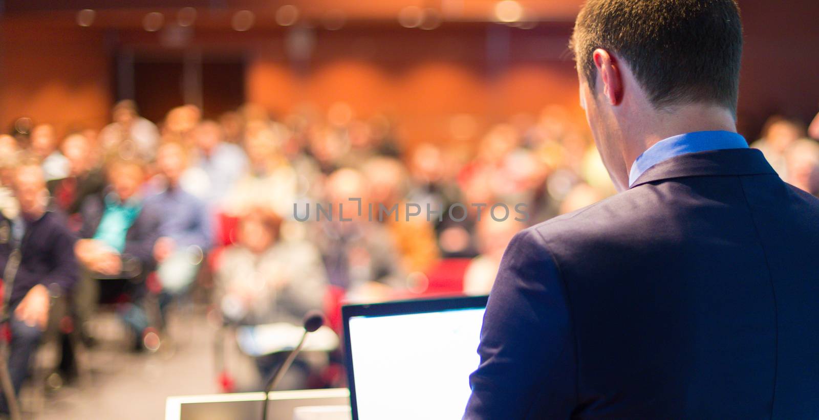 Speaker at Business Conference with Public Presentations. Audience at the conference hall. Entrepreneurship club.