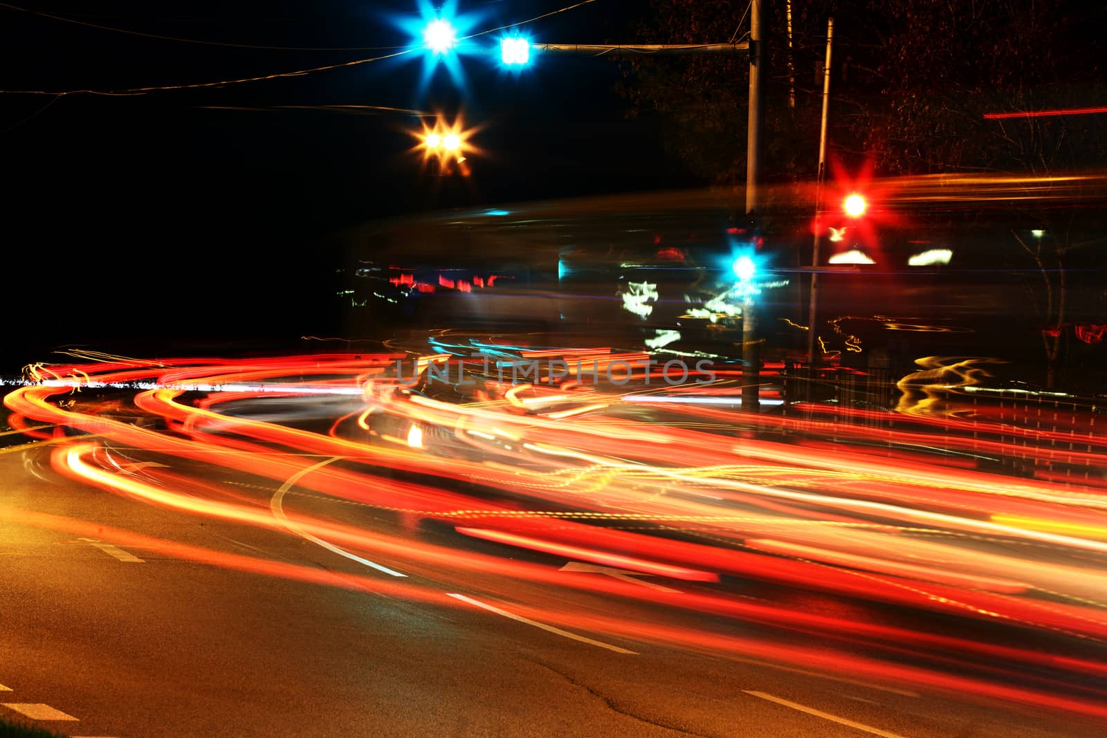 Traffic at night with traces of car lights