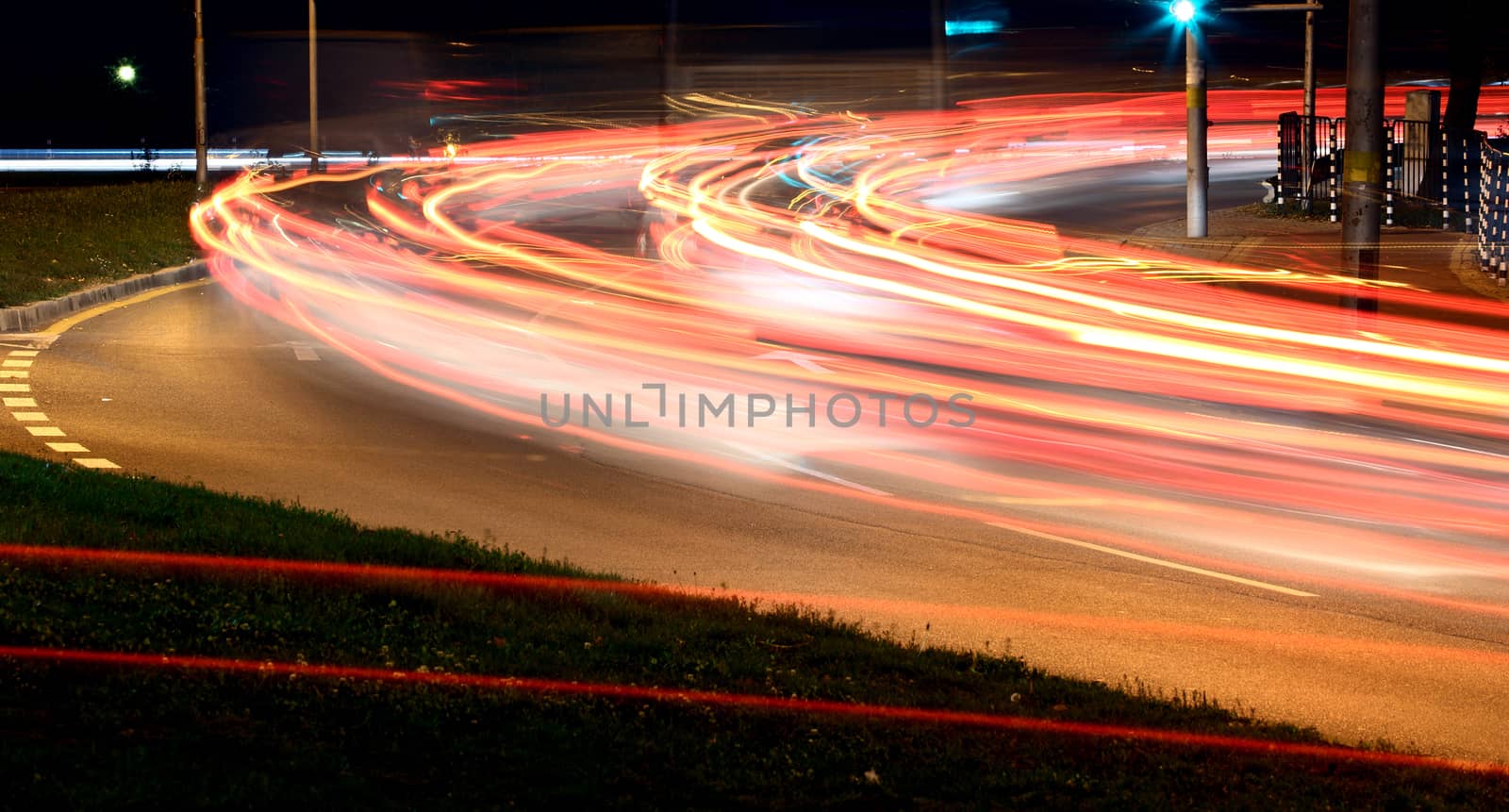 Traffic at night with traces of car lights