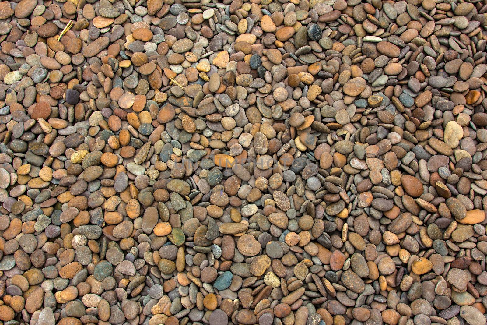 Pile of round peeble stones for background