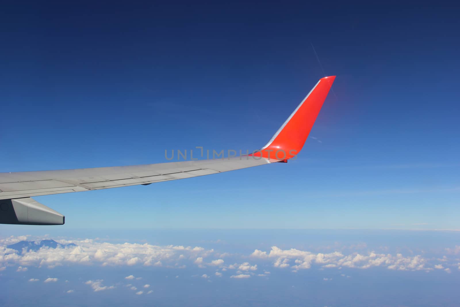 Soft clouds over view from airplane flying