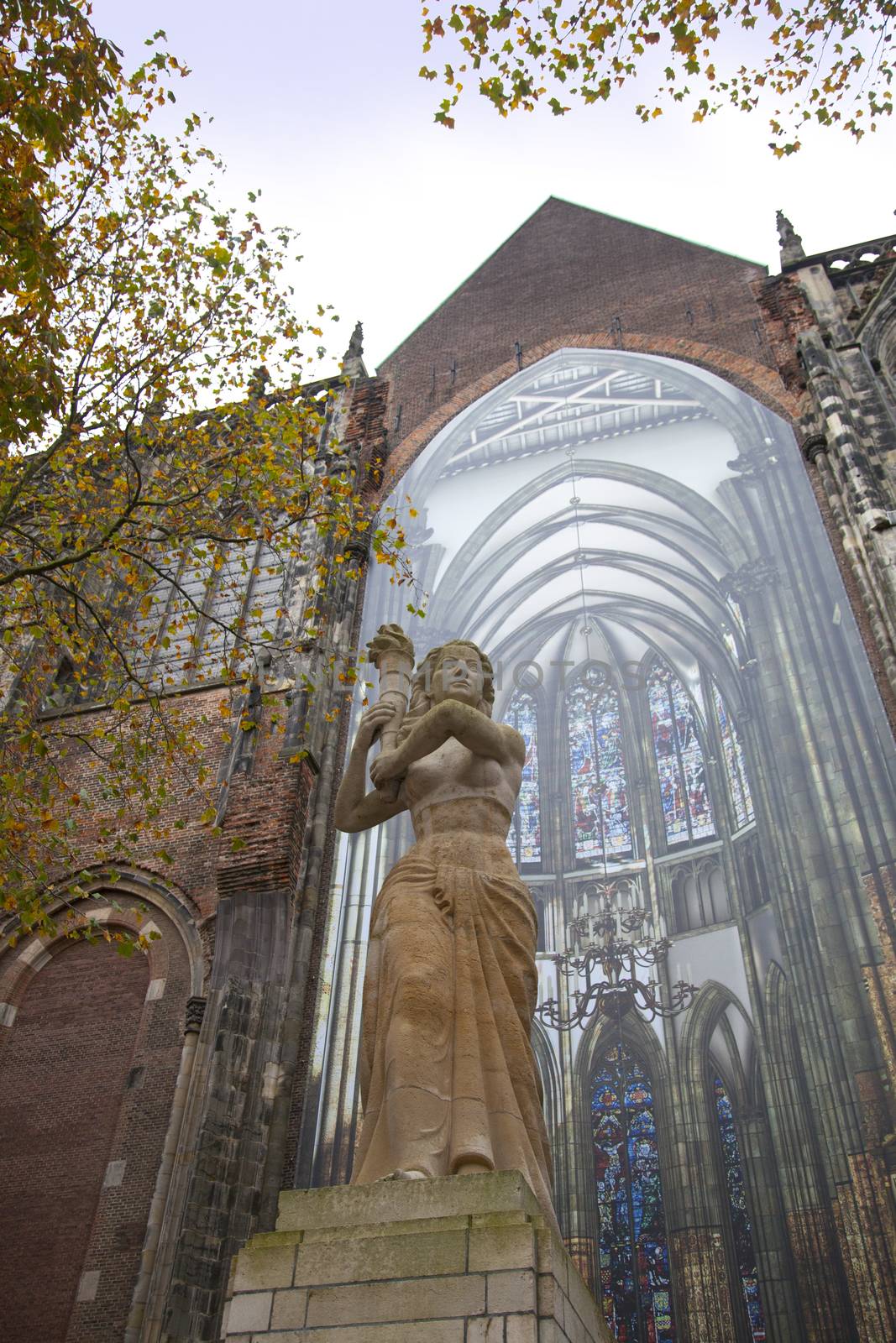 The statue of Corinne Franz�n-Heslenfeld in the direction of the Dom of Utrecht, Netherlands 