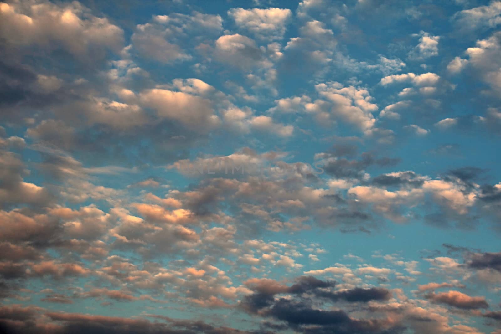 Photo shows blue sky and various clouds.