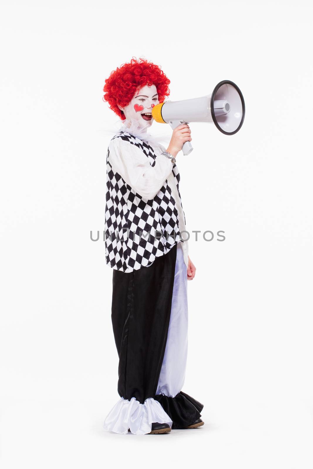 Clown in Red Wig and Makeup Using Megaphone. by courtyardpix