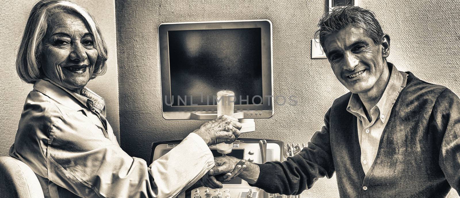 Mature female doctor examining man in 40s. Wrist and arm scan.