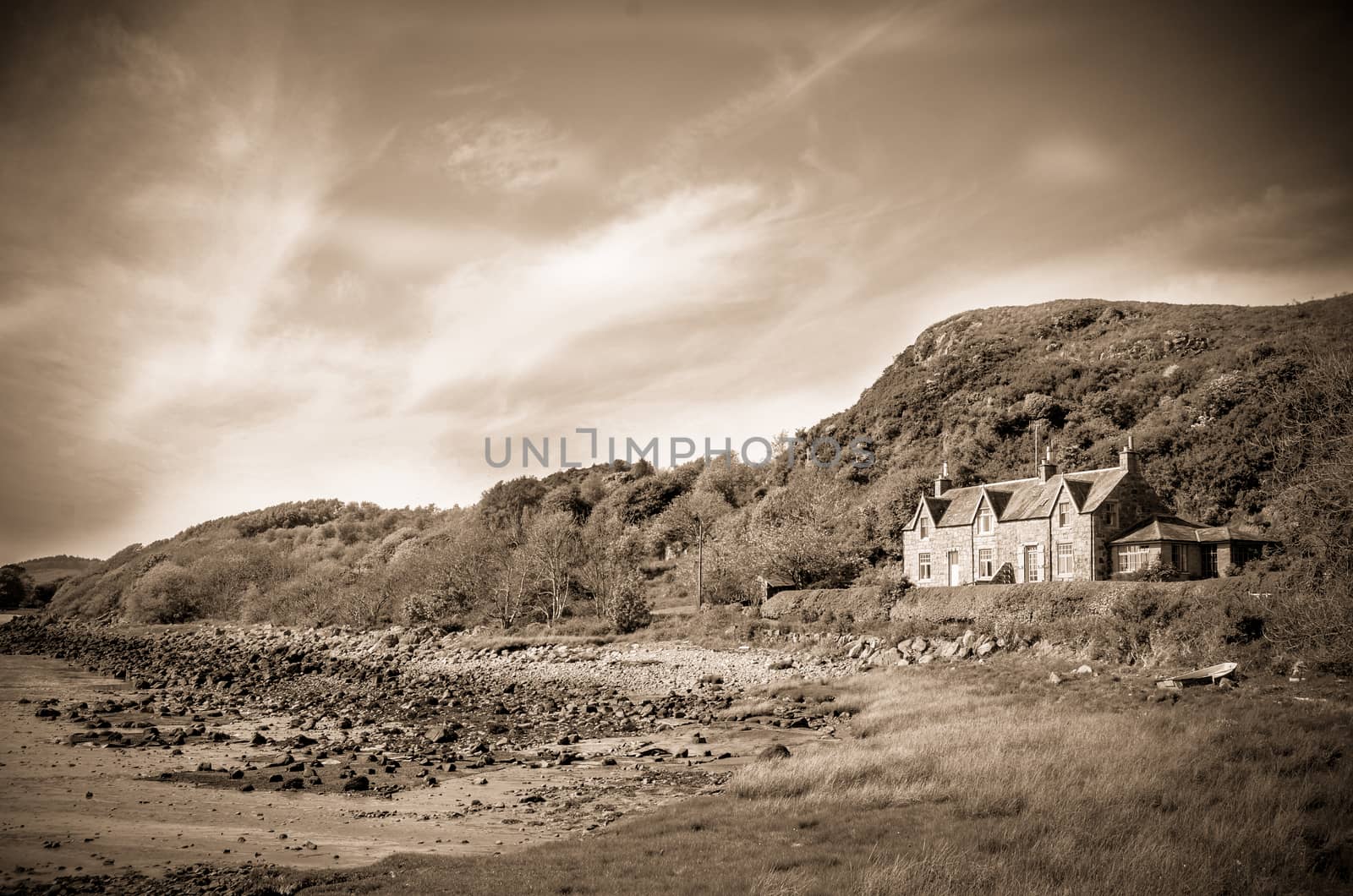 Retro Style Sepia Photo Of A House By Sea In The Countryside