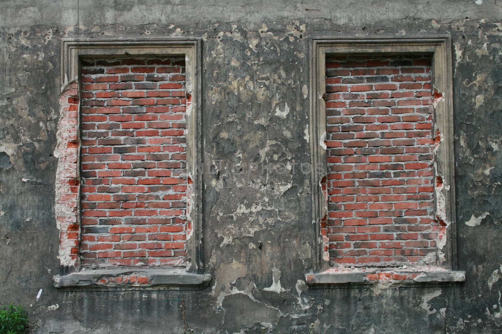 Bricked up windows in old building - outdoor image 