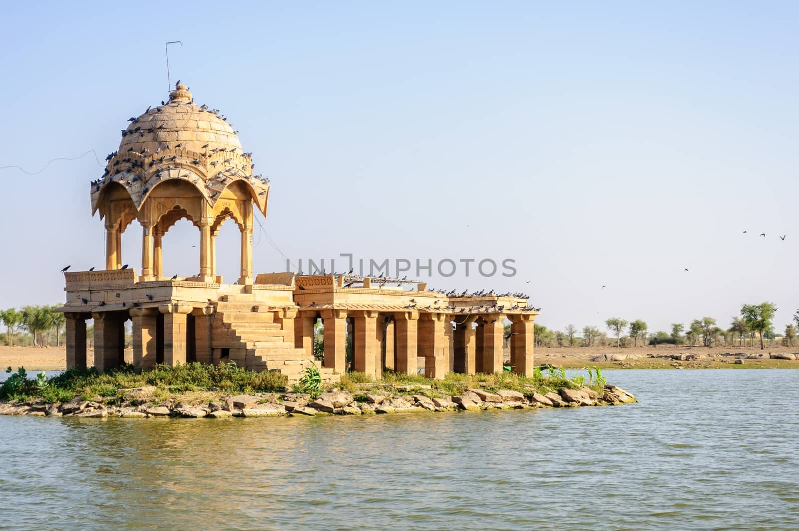 Ancient hindu stone temple in the middle of Gadisar lake, Jaisalmer, Rajasthan