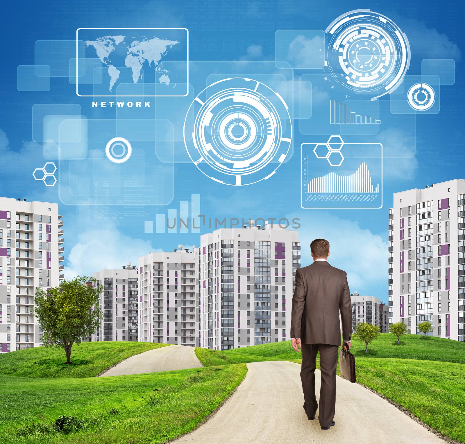 Businessman in suit walking along road through green hills. Rear view. City of tall buildings in background. Charts and other virtual items in sky. Business concept