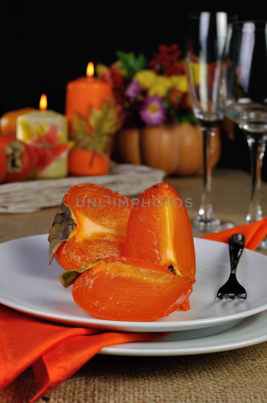 Slices of juicy ripe persimmon on a plate