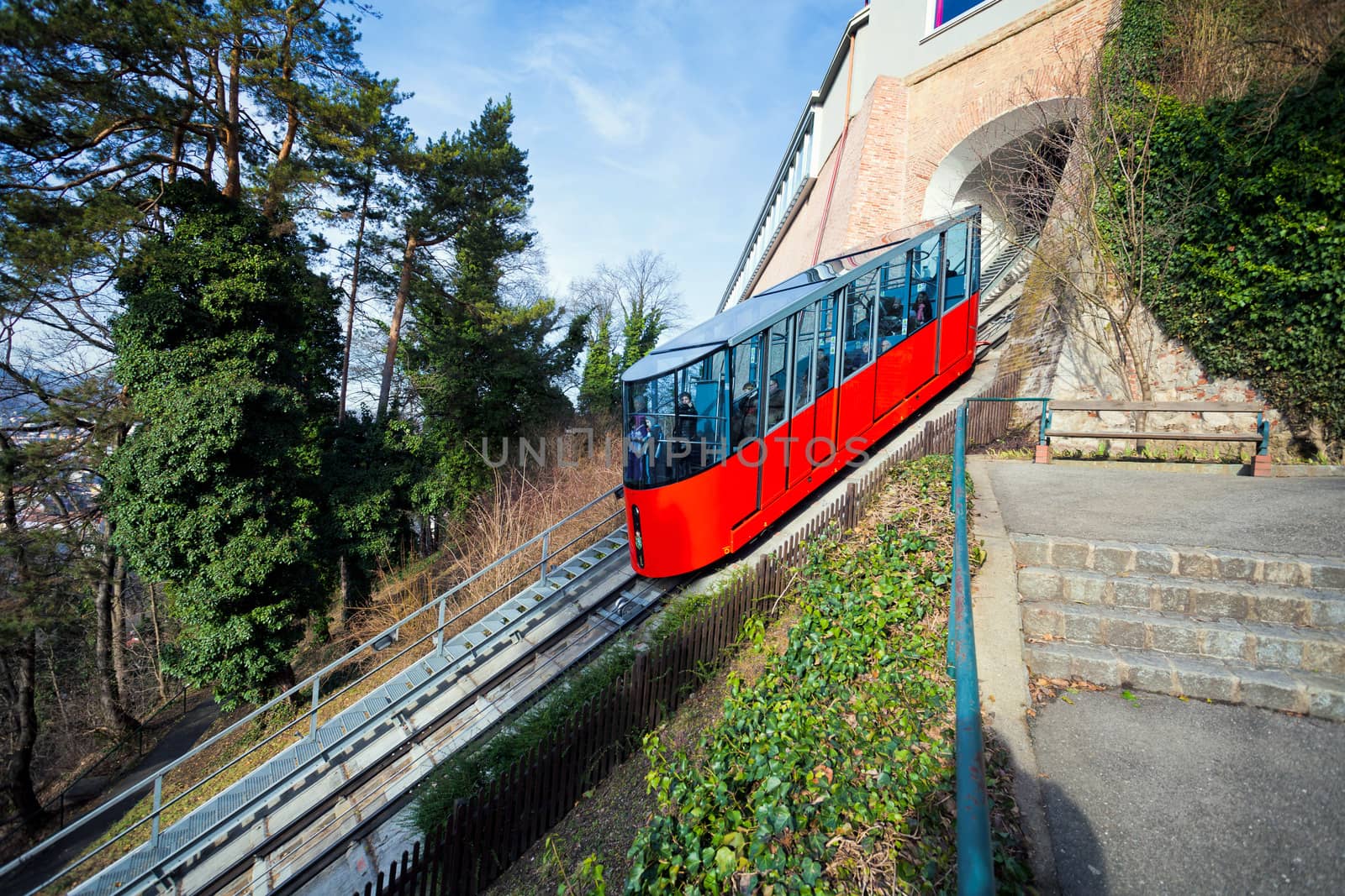 Graz, Austria - January 16, 2011:  Modern funicular climbing to Schlossberg and Graz city panoramic view, Austria