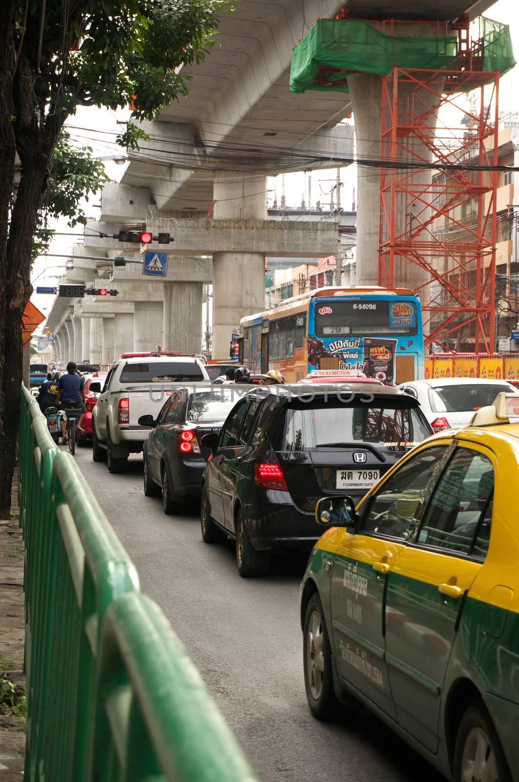 Traffic jam below construction blue line of bangkok sky train by eaglesky