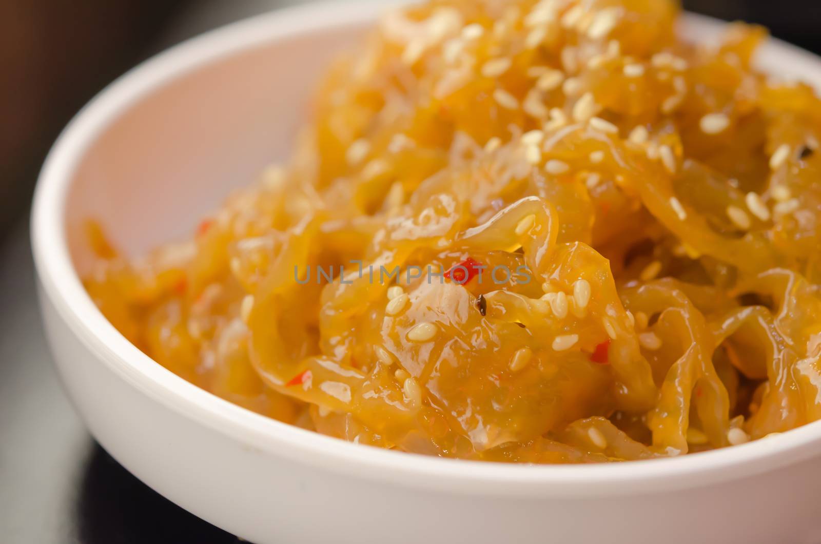 gourmet tossed jellyfish salad in white bowl , Chinese cuisine