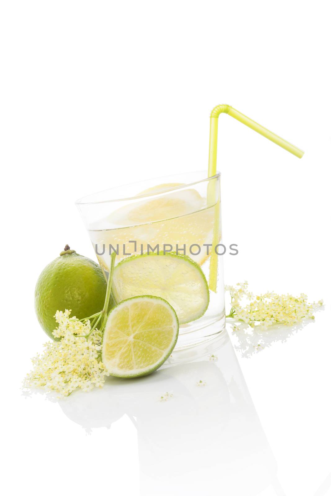 Homemade organic lemonade. Elderberry lemonade with lime and lemon and elderberry blossom isolated on white background. Delicious summer drink.