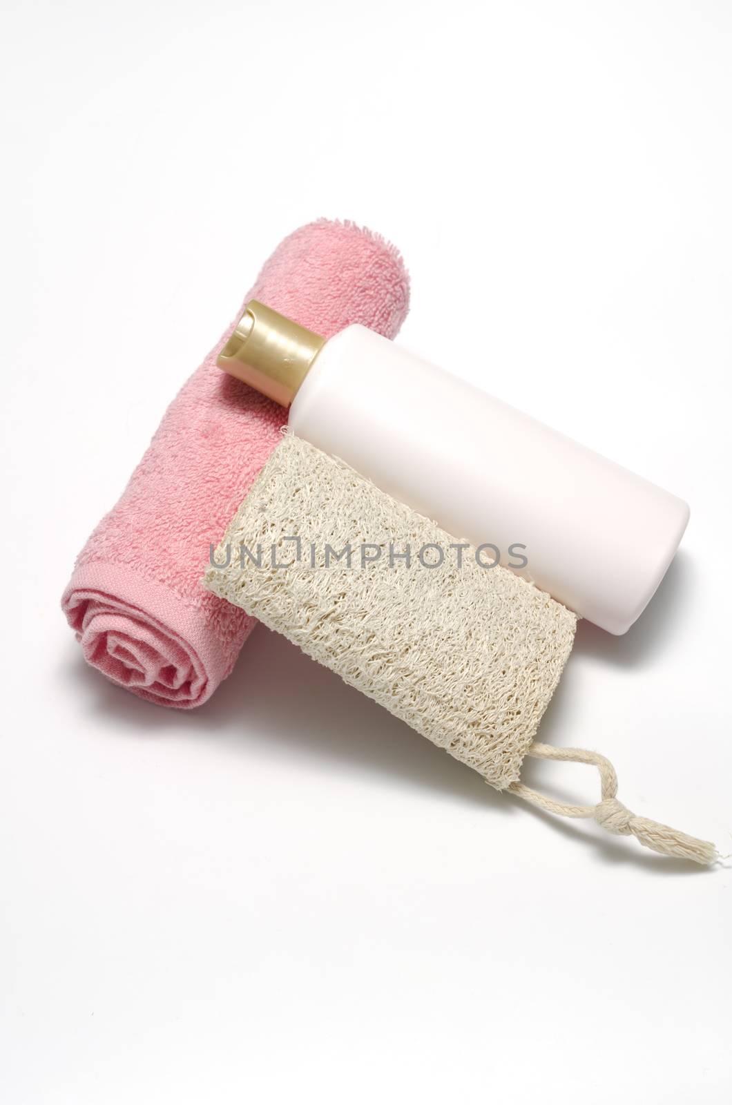 liquid soap loofah and pink towel isolated on a white background