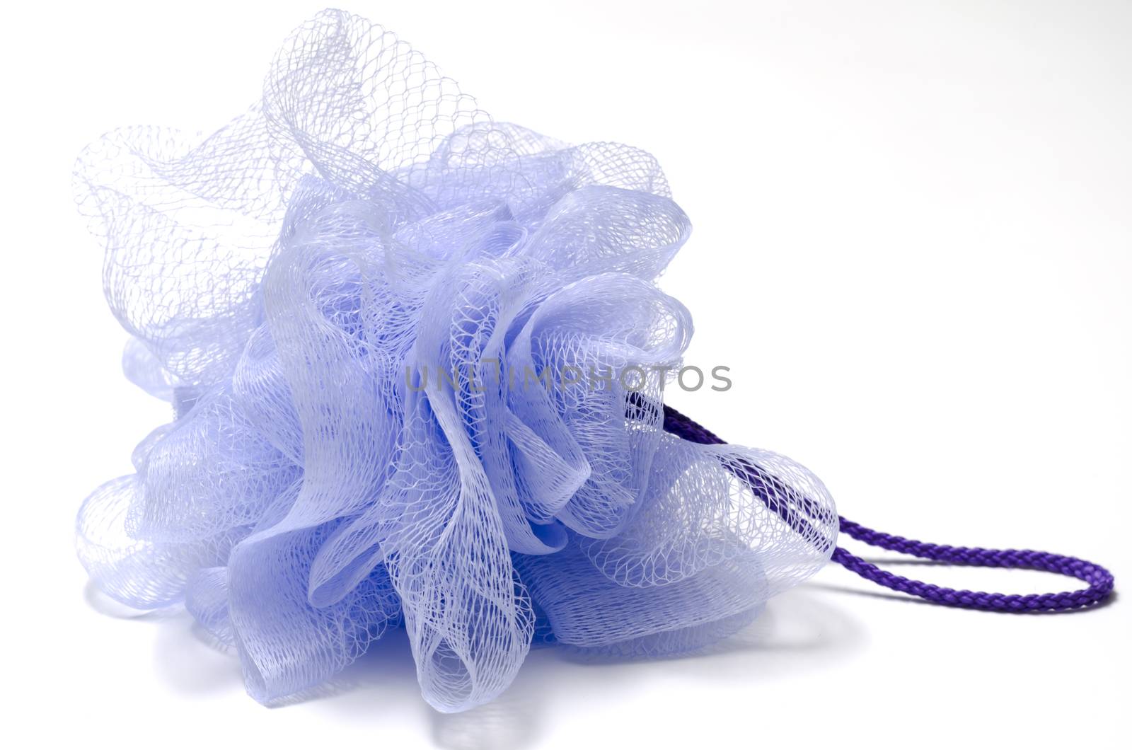 purple bath puff isolated on a white background