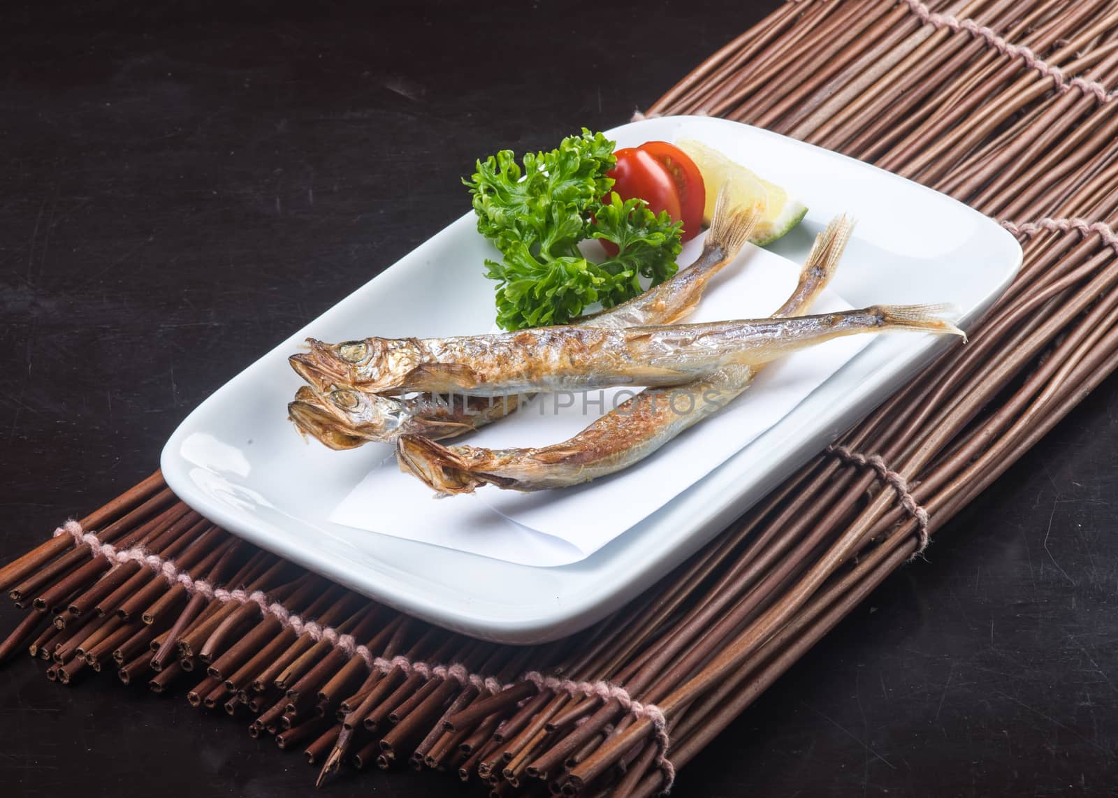 japanese cuisine. fried fish on background