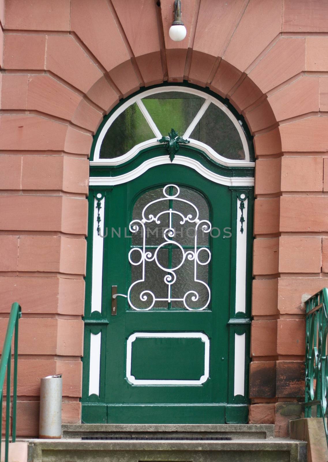 A green, white painted door 