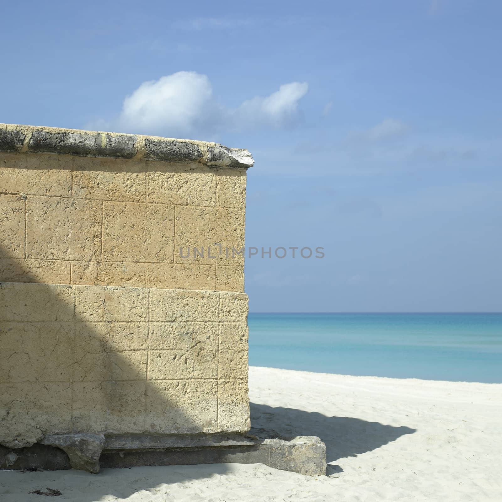 Edge of a stone walled structure on a beach