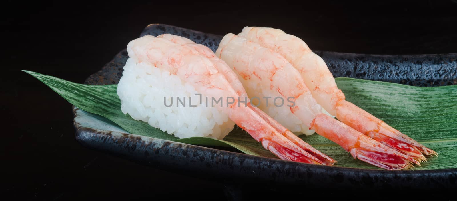 japanese cuisine. sushi shrimp on the background by heinteh