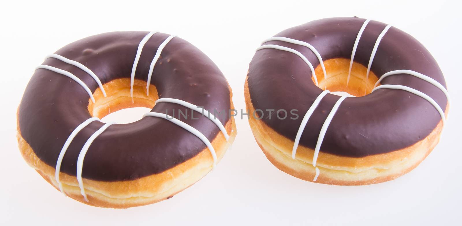 chocolate donuts on a white background by heinteh