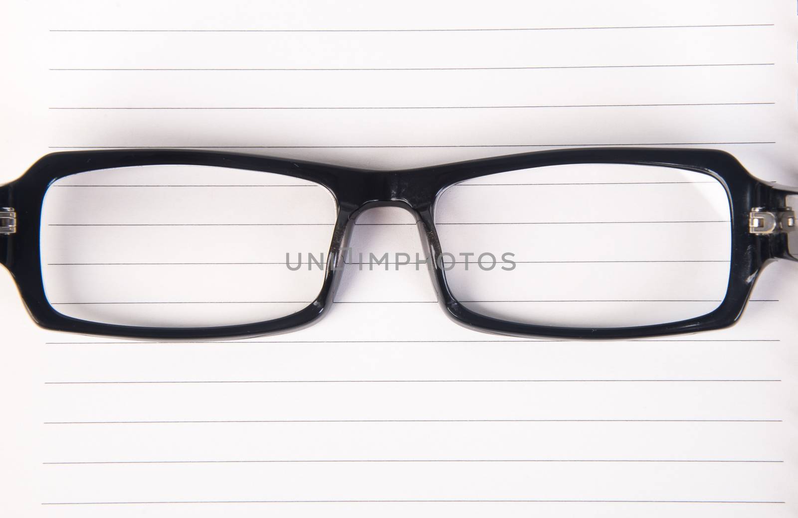 eye glasses. eye glasses with book on background