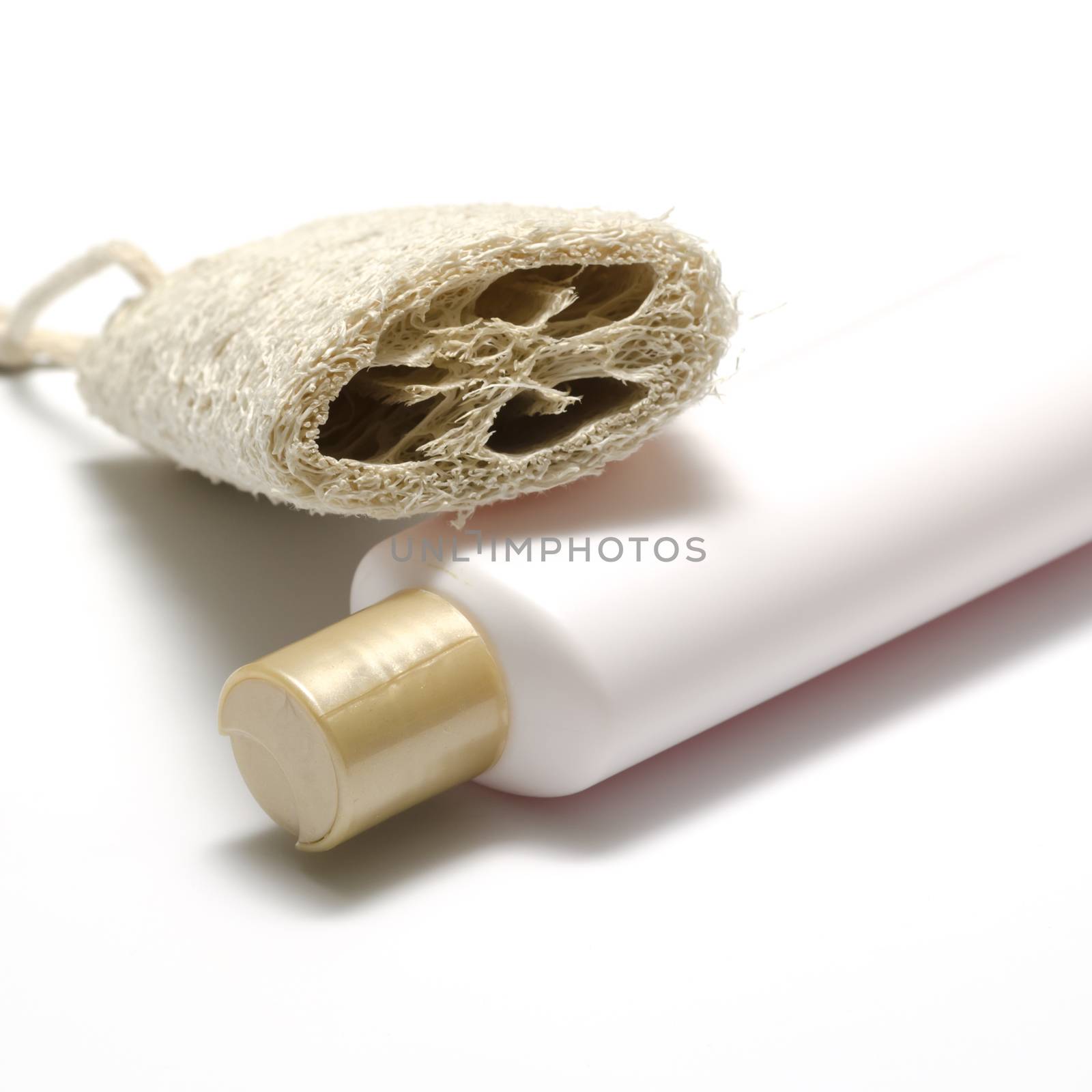 loofah and liquid soap isolated on a white background
