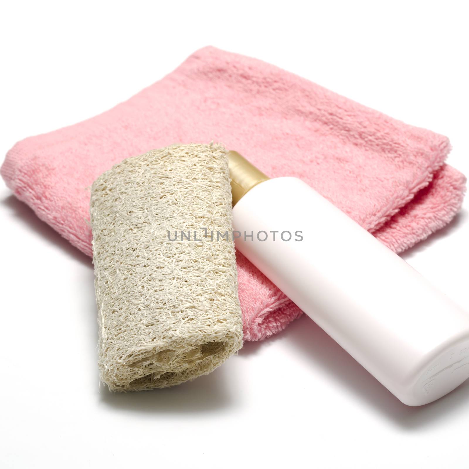 liquid soap loofah and pink towel isolated on a white background