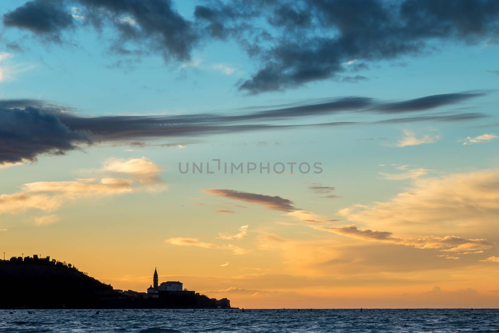 Silhouette of the town Piran with cathedral, view from strunjan