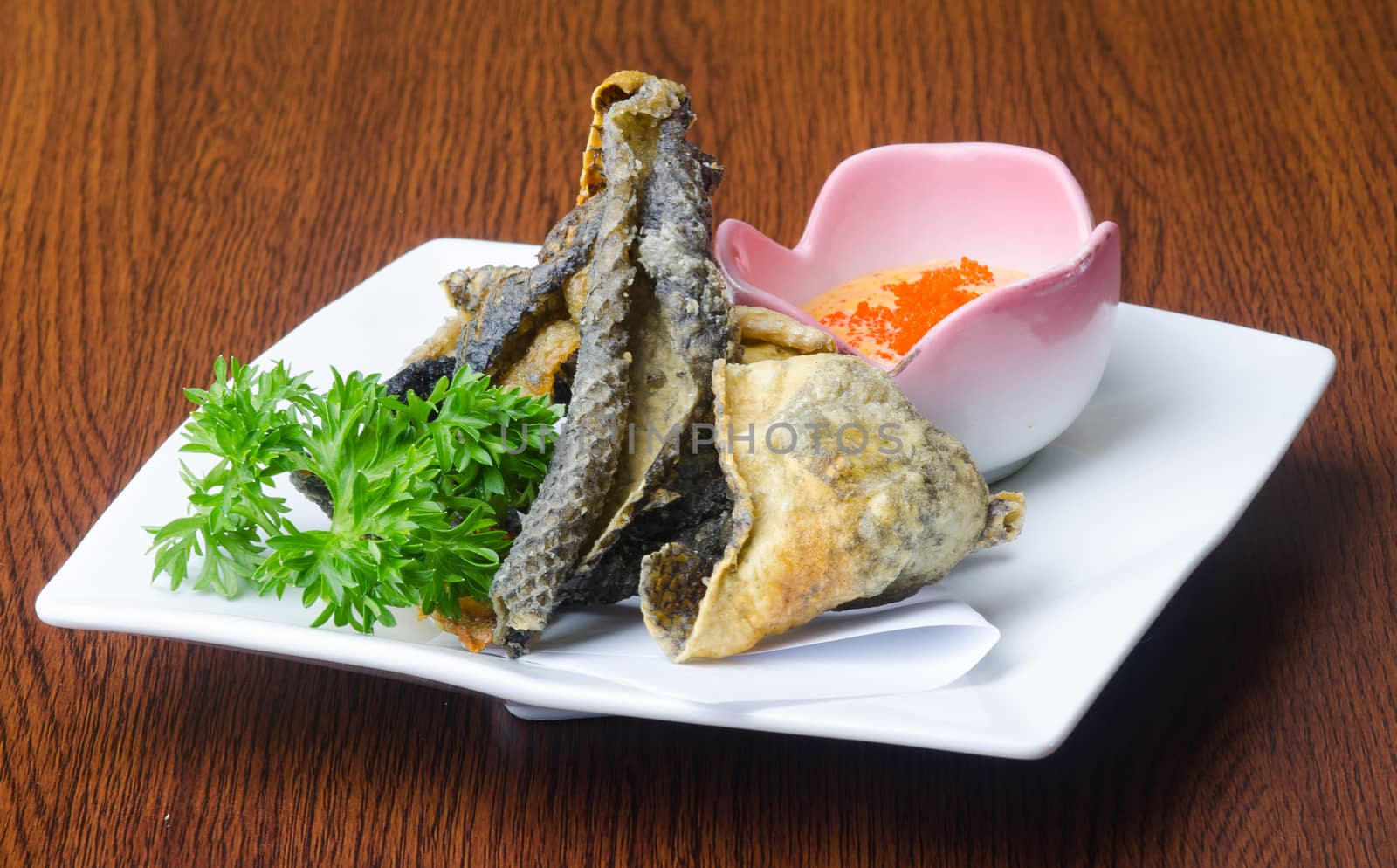 japanese cuisine. fried fish skin on the background by heinteh