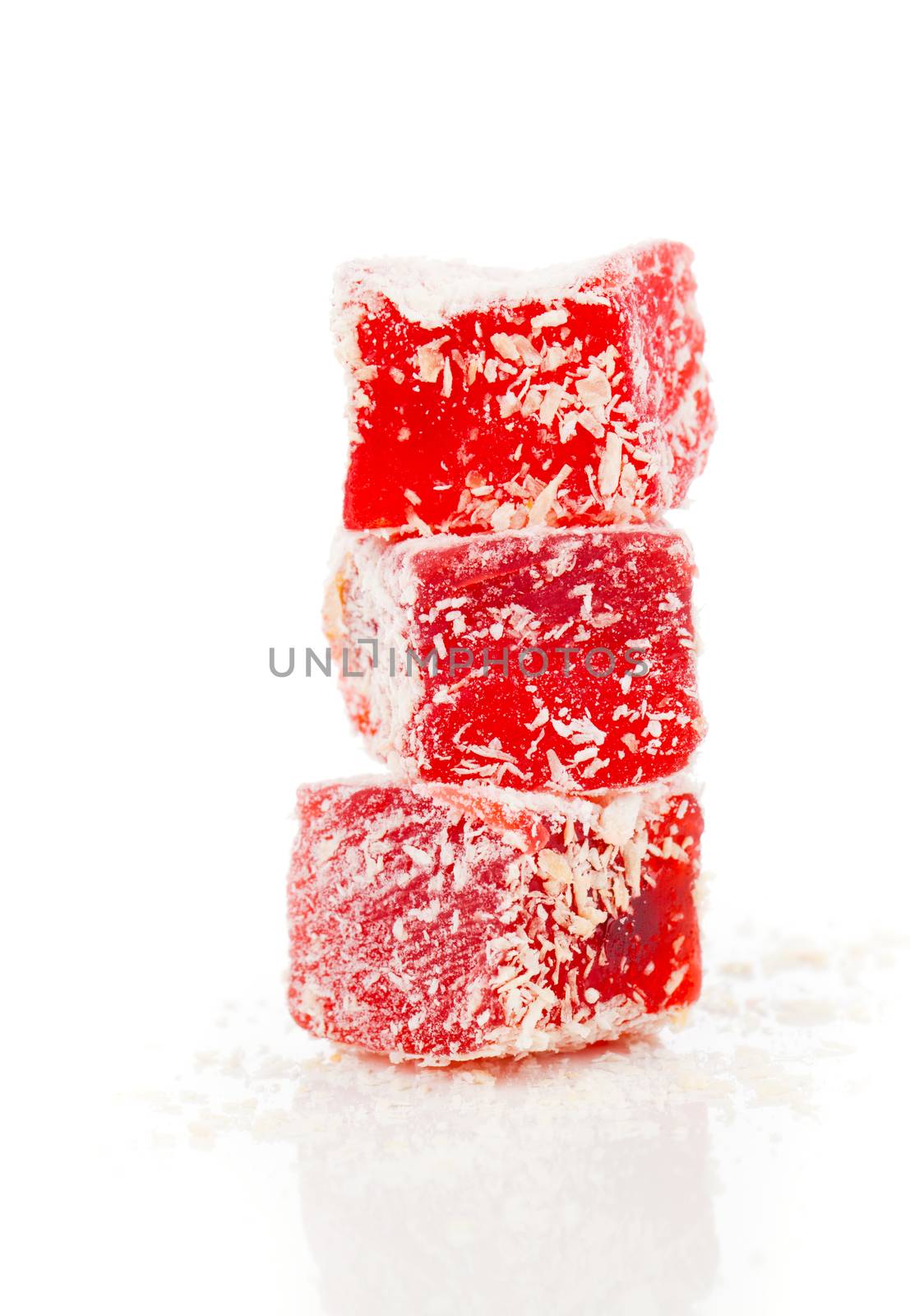 Sweet pieces of turkish delight on white background by motorolka