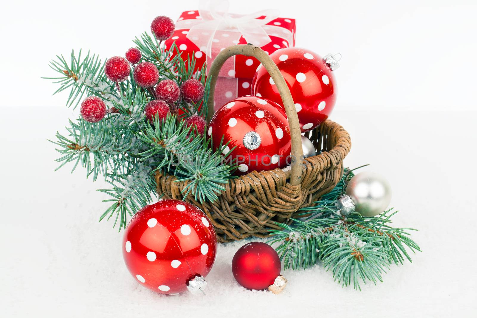 Christmas balls and fir branches with decorations isolated over white