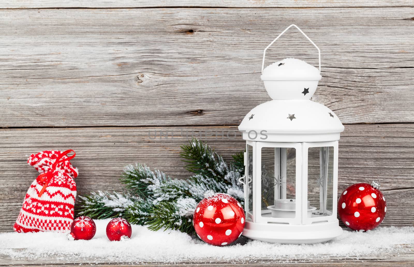 Christmas decoration over snow, wooden background