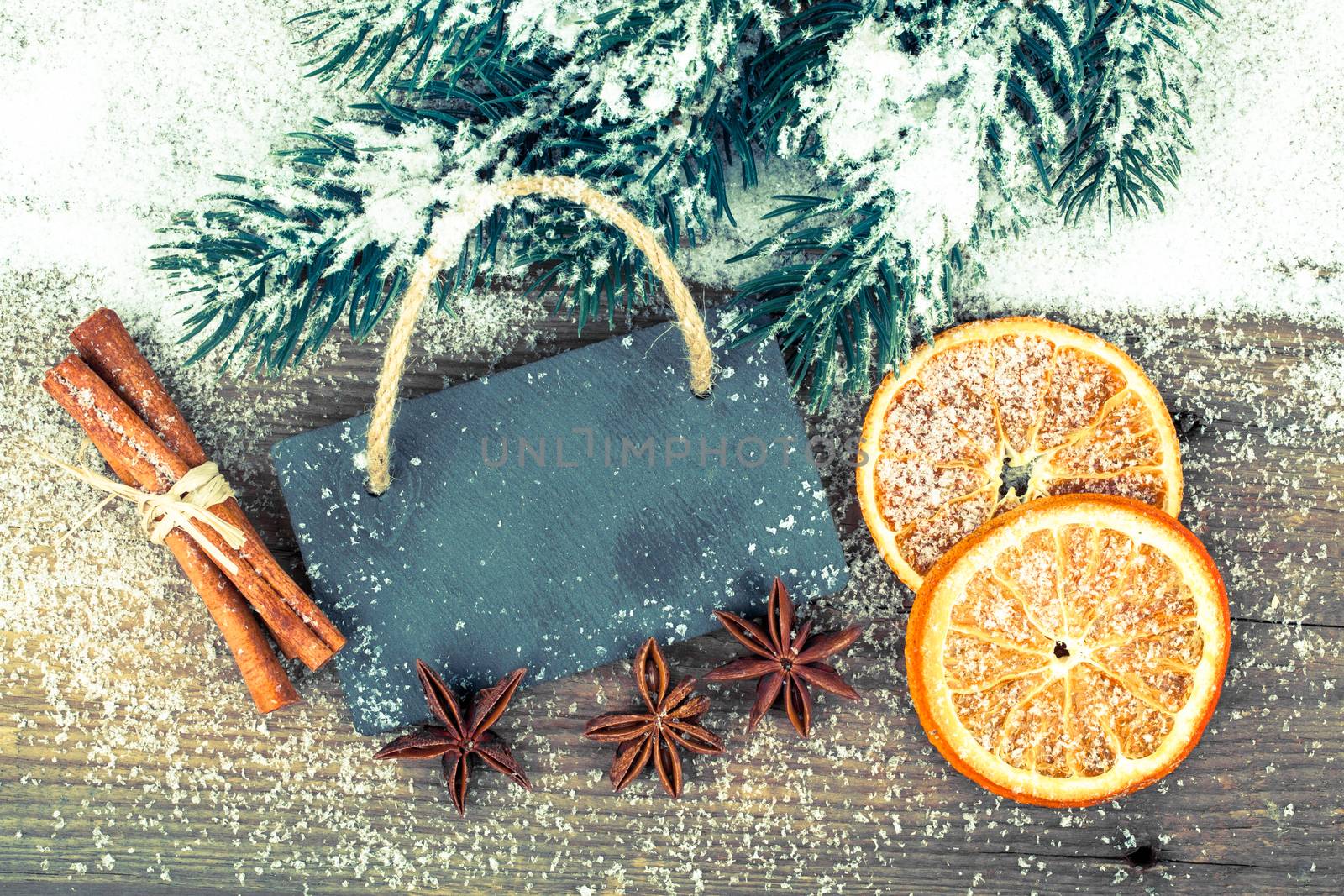 Christmas decoration with slate board, over wooden background