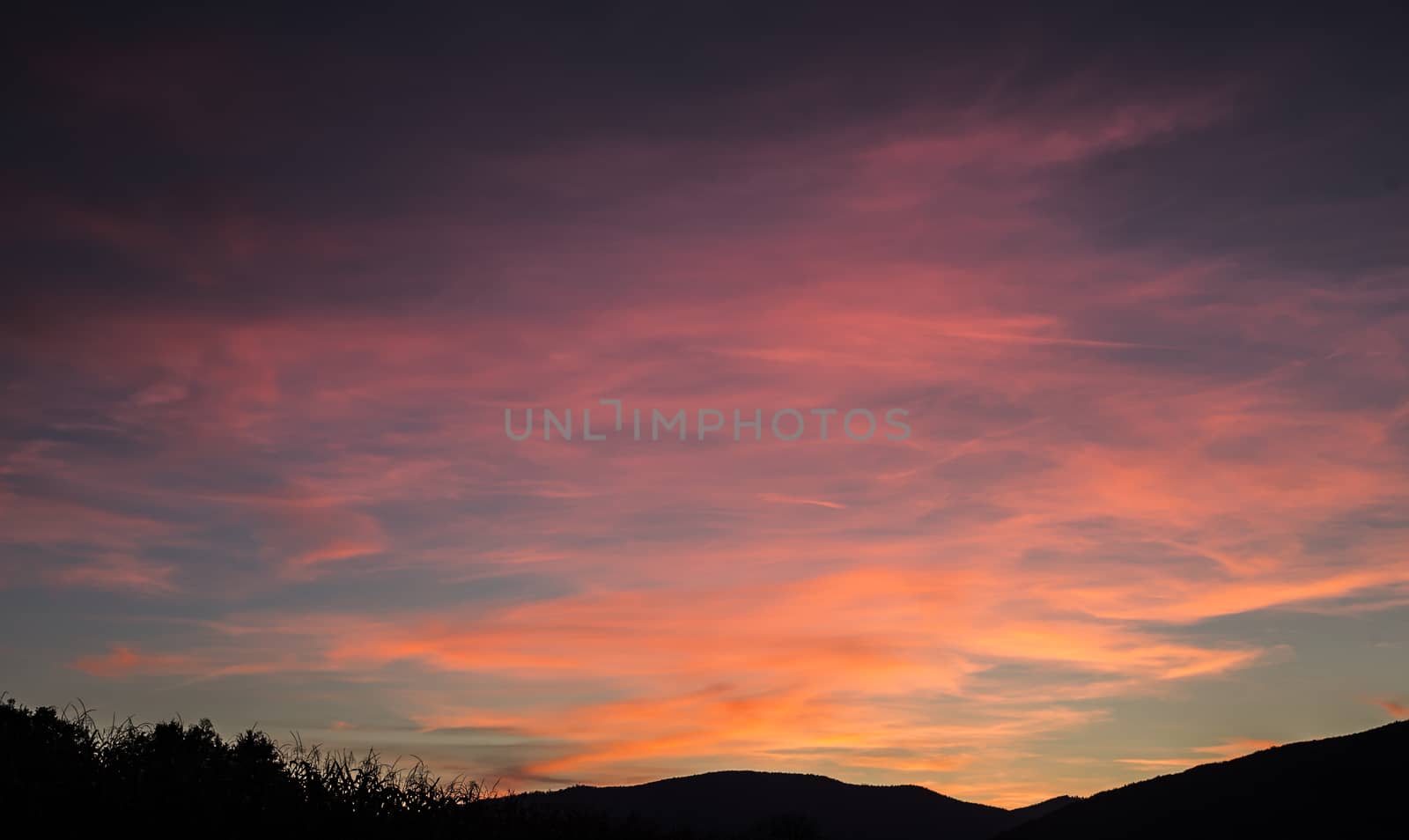 Sunset with landscape silhouette by photosampler