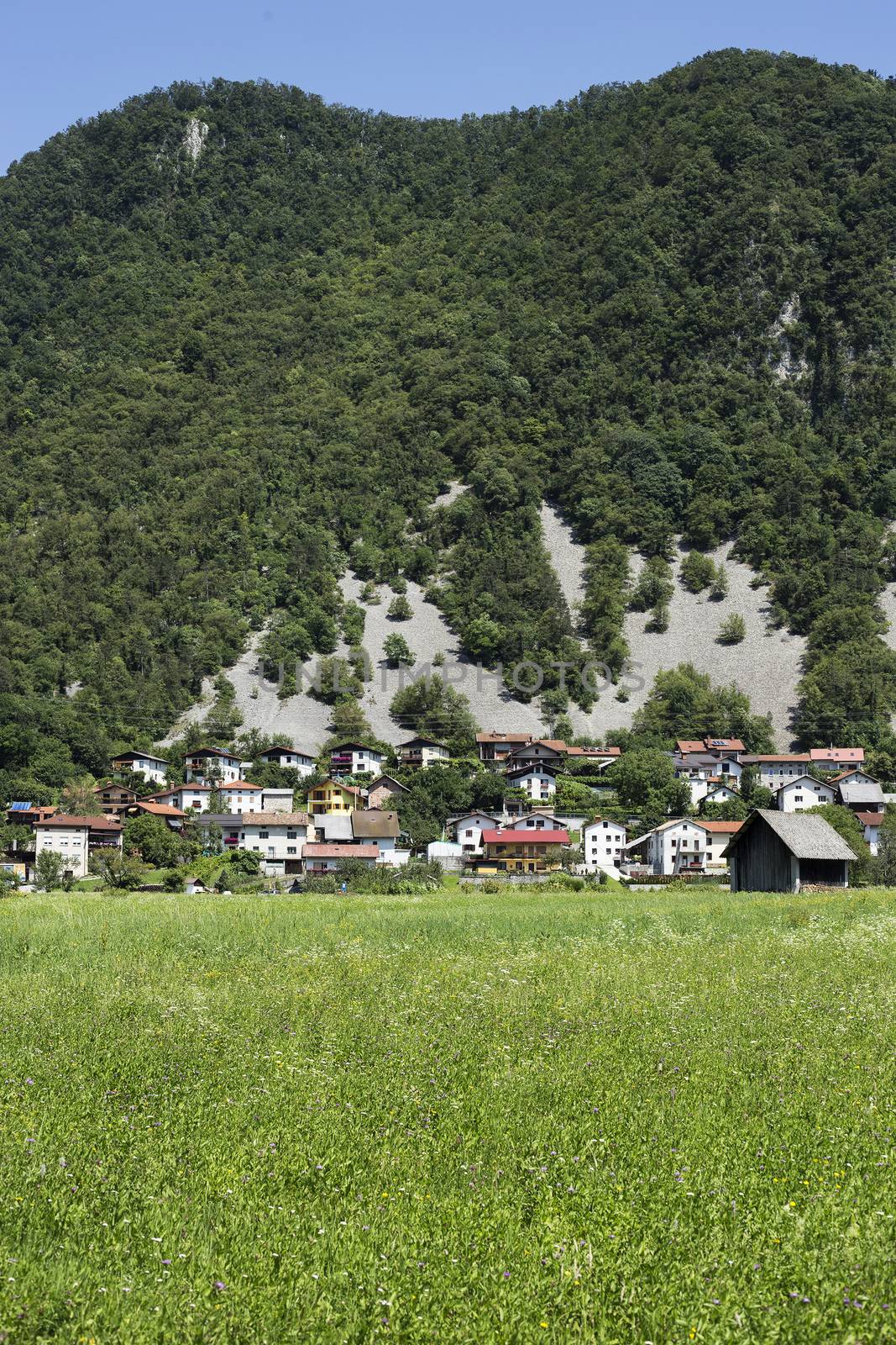 Village below the hill  by photosampler