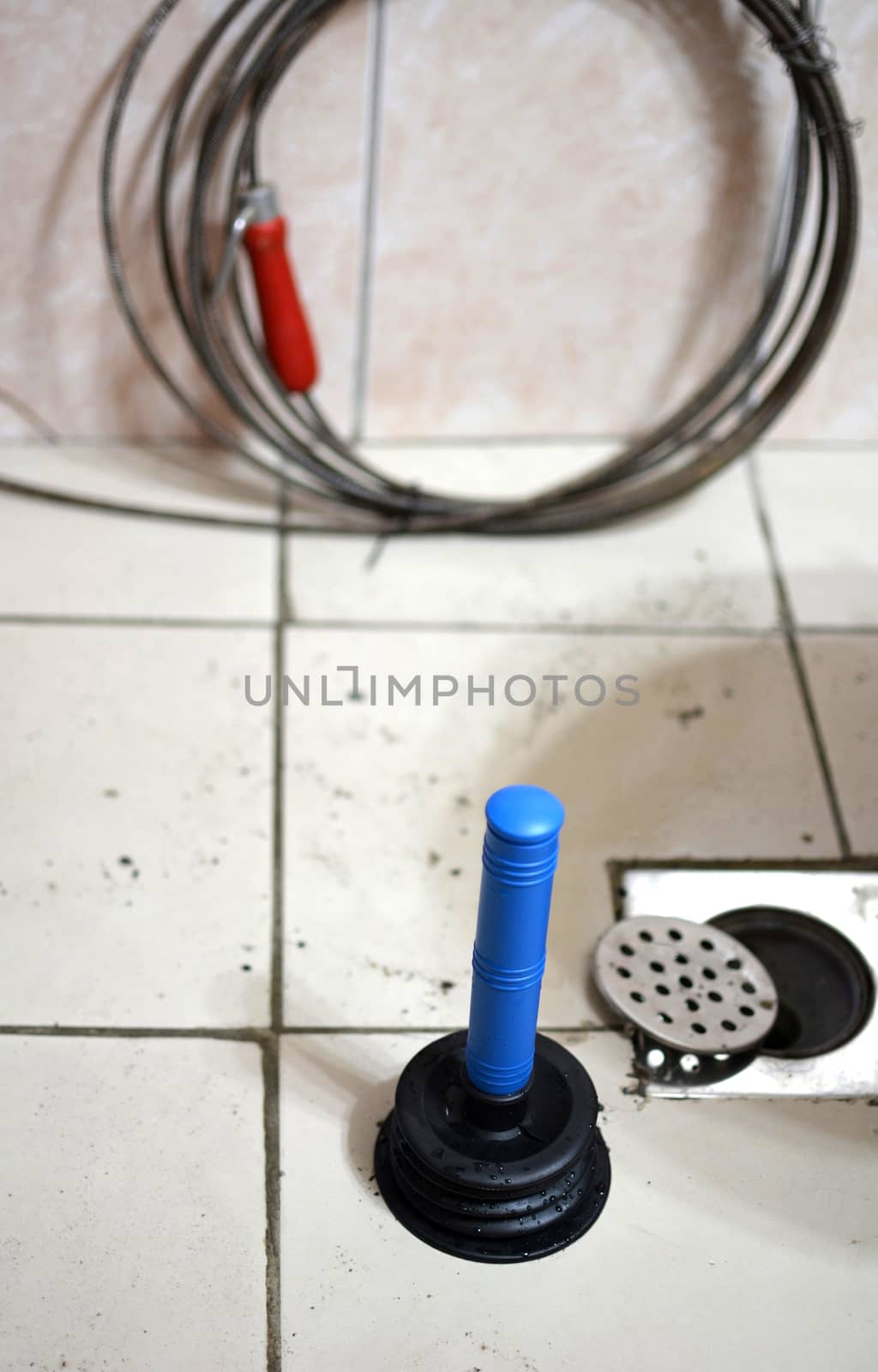 Plunger, some wires, and a clogged drain.