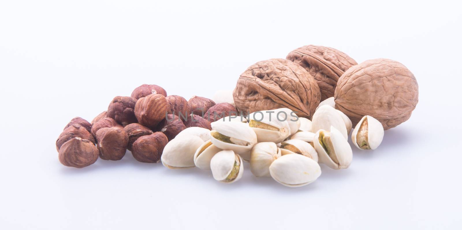 nuts. mixed nuts on the background by heinteh