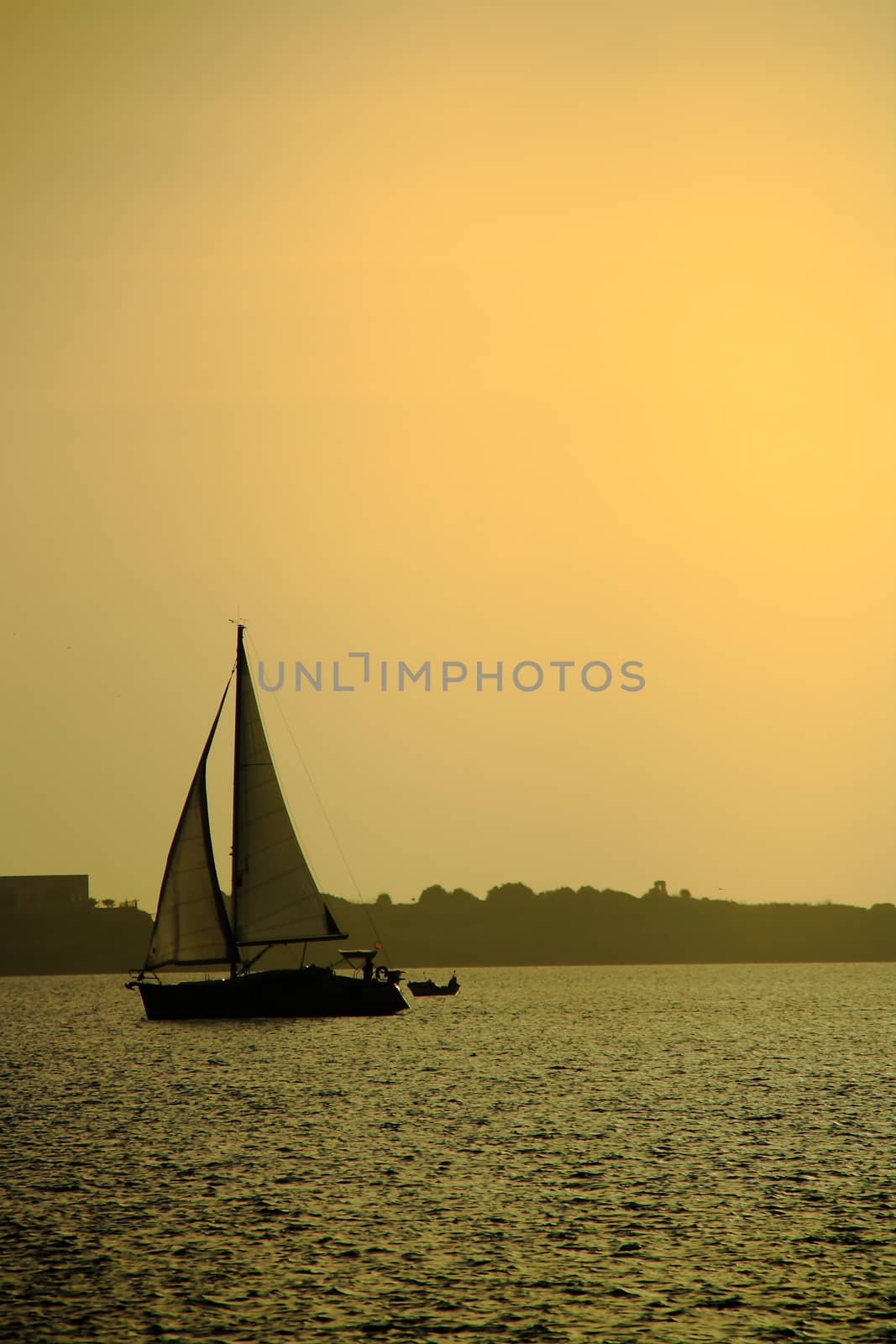 yachting at sunset on sea by mturhanlar