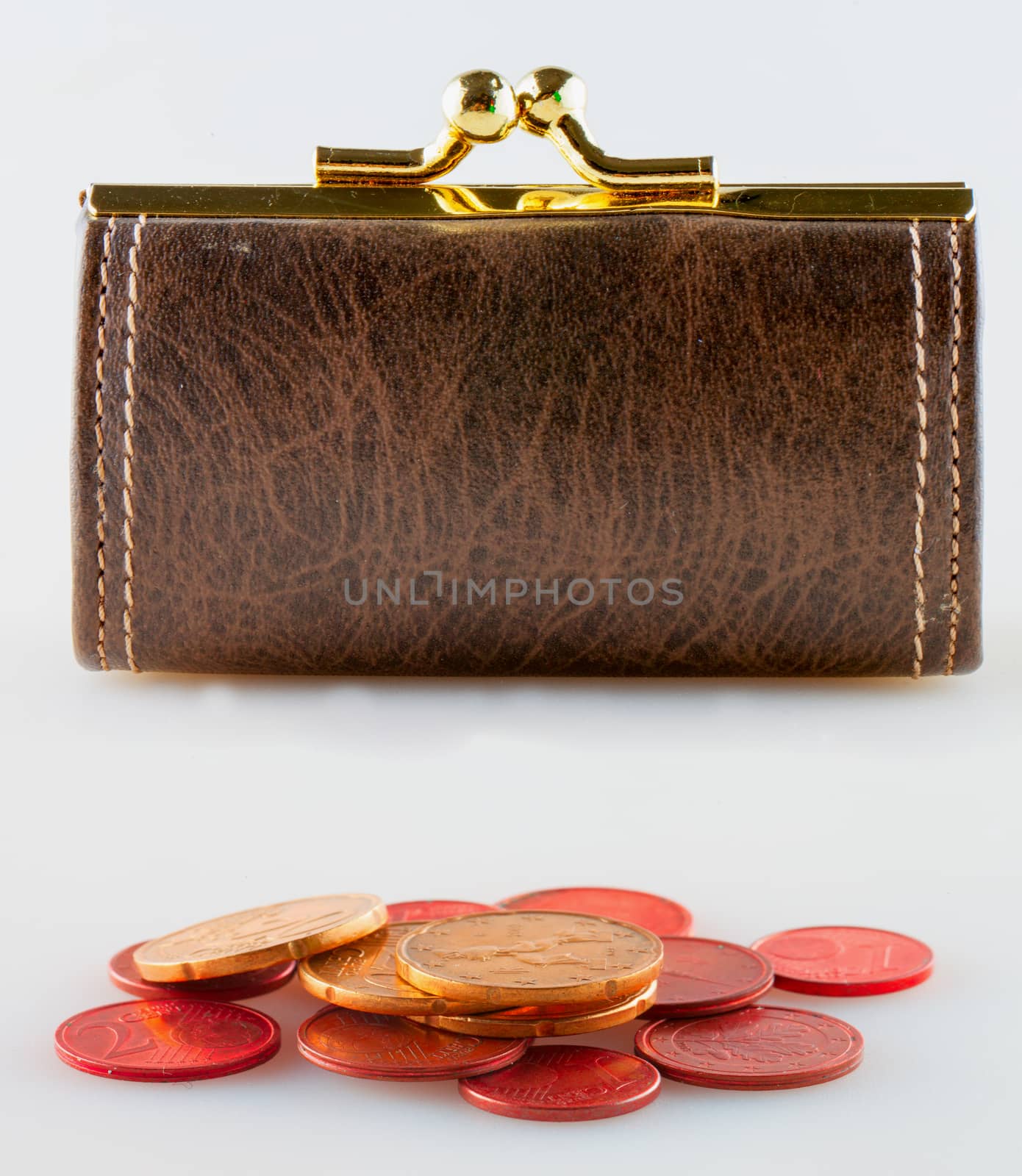 Leather purse behind euro money, white background