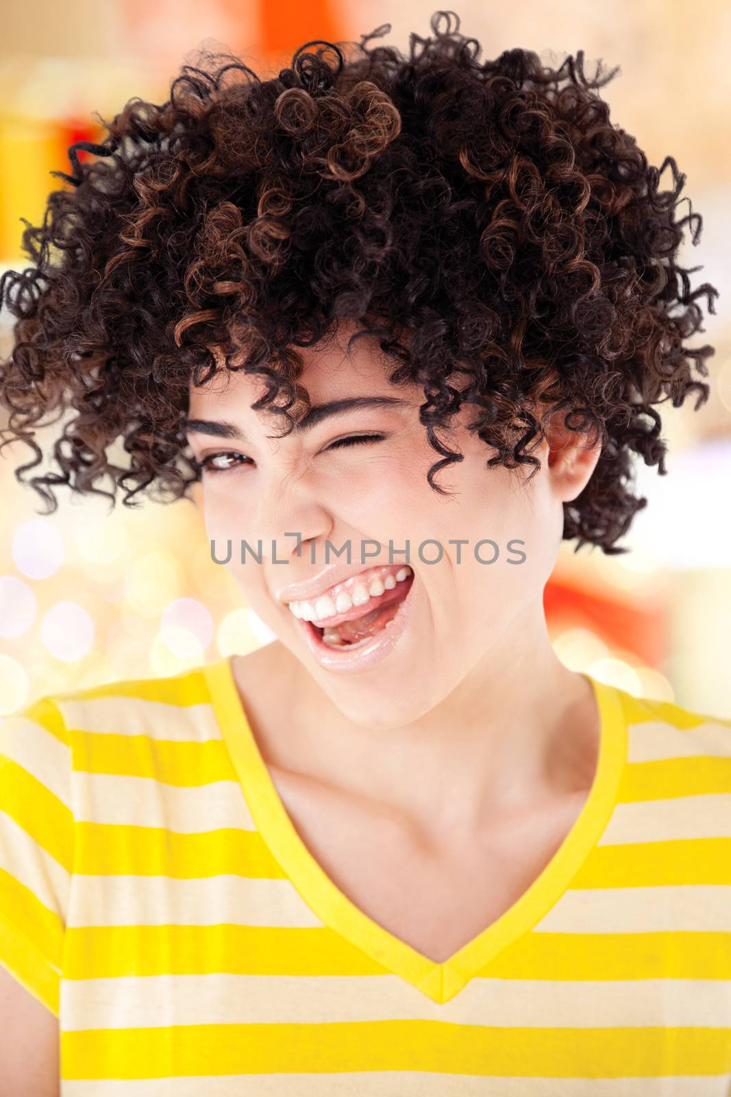 Young girl with curly hair and shirt with yellow stripes isolated with work path.