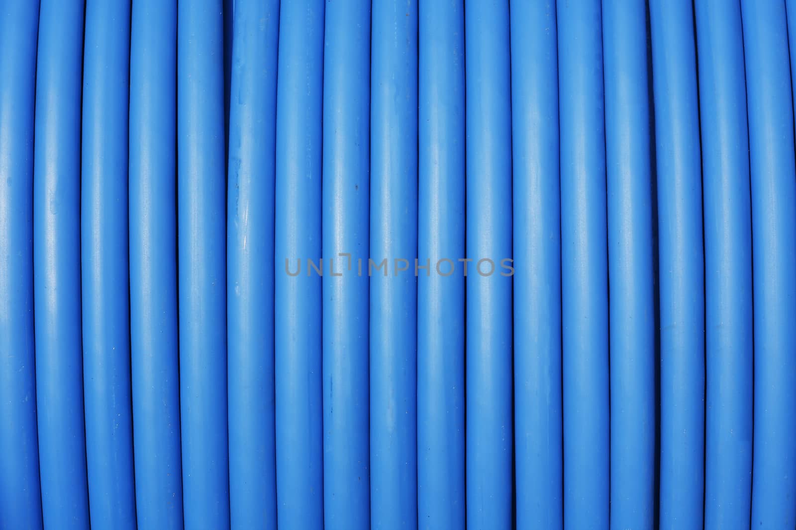 photo of close-up blue cable stored on reel 