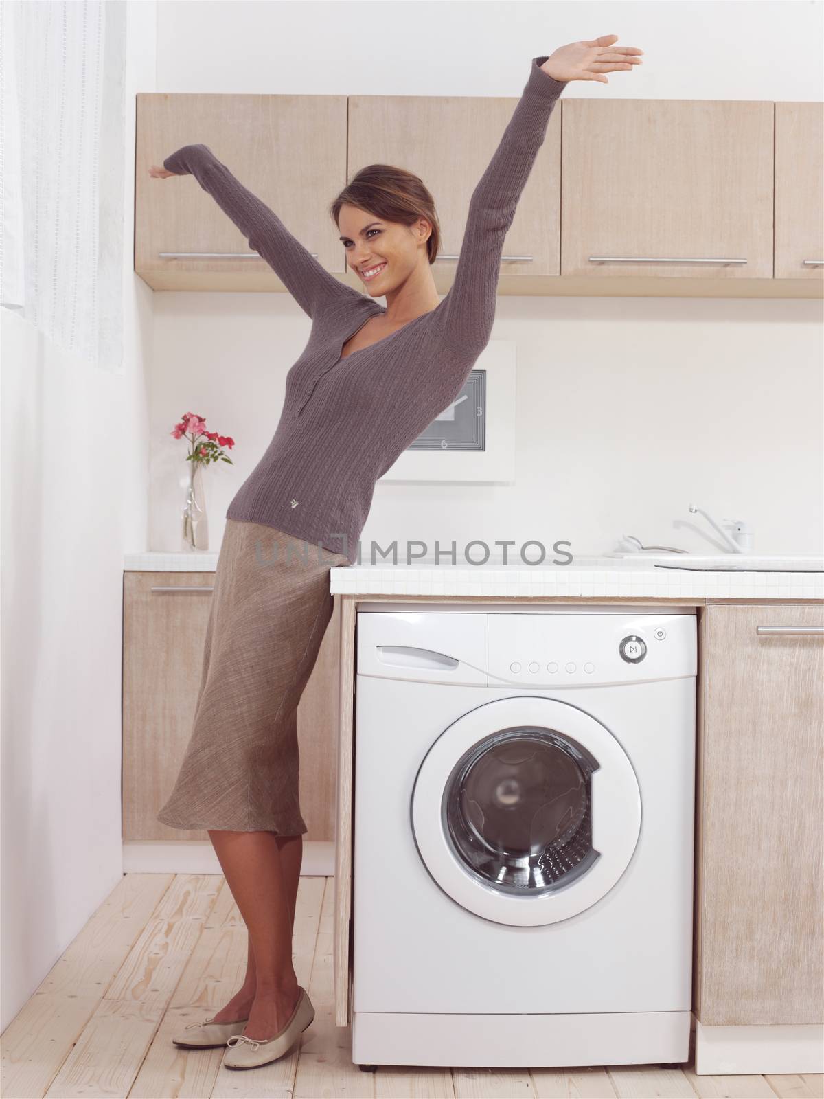 pretty smiling woman in the laundry room 