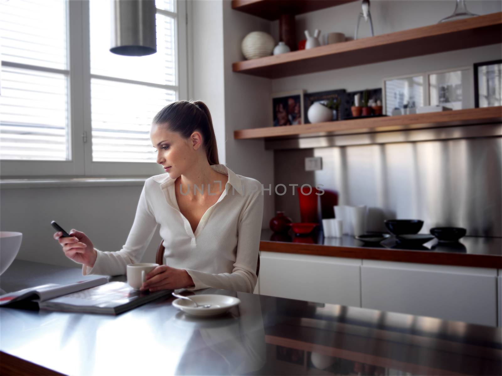 middle woman enjoying a conversation in the kitchen