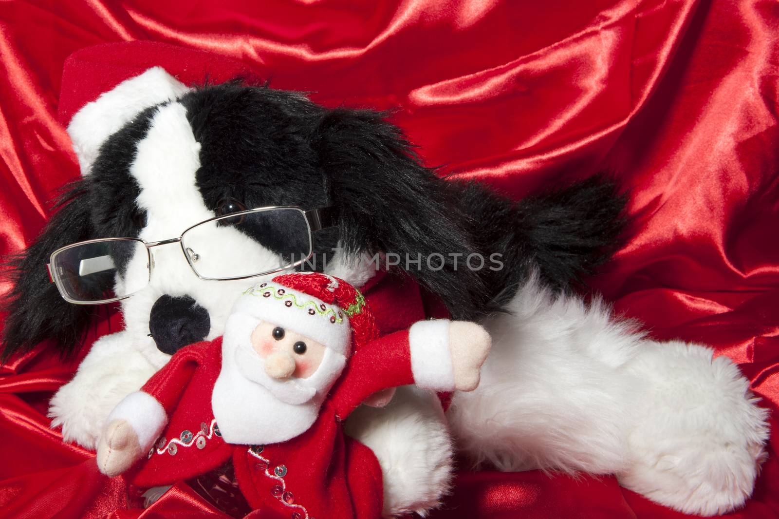 a doll with hat of santa claus and gifts
